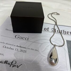 Authentic GUCCI Sterling, silver teardrop pendant with box and certificate